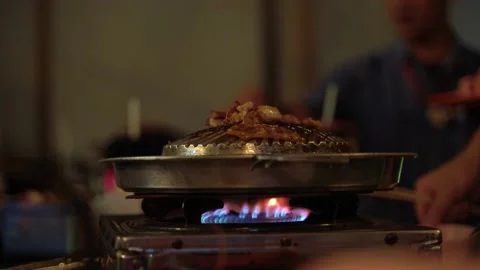 Thai common buffet, grill pork or barbecue on hot pan Video stock 158292160