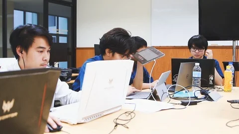 Thai Computer Engineering students working on their laptop computer Stock Footage 107373123