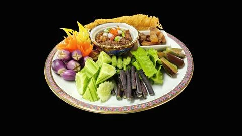 Thai crab egg chili paste with sweet pork and vegetables on a Benjarong plate. Stock Photos