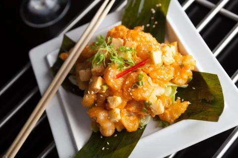 Thai crispy shrimp dish with apple and sesame seeds presented beautifully on  Stock Photos