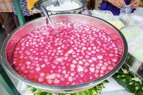 Thai dessert red sweet ruby framework in big stainless steel bowl Stock Photos