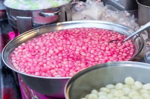Thai dessert red sweet ruby framework in stainless steel bowl on table Stock Photos