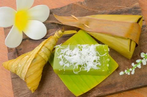 Thai dessert sticky rice wrapped in banana leaf Stock Photos