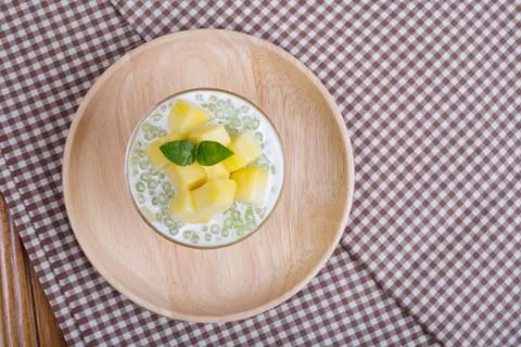 Thai dessert of tapioca pearls pudding with mango Stock Photos