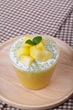 Thai dessert of tapioca pearls pudding with mango Stock Photos