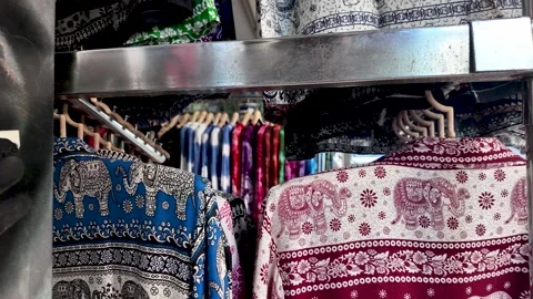 Thai elephant patterned shirts hanging on a rack Stock Footage 321531582