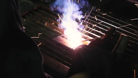 Thai Engineer student perform the electric welding in the workshop class Stock Footage 98460820