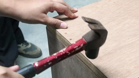 Thai Engineer students hammer the nail in carpentry workshop class. Stock Footage 98201309