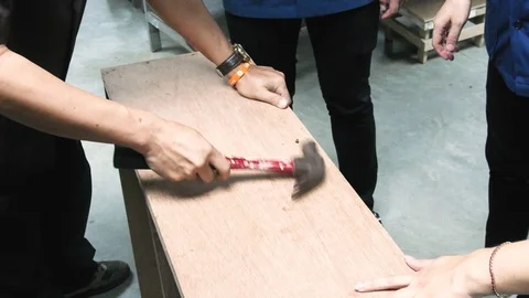 Thai engineer students take turn to hammer the nail. Stock-Footage 98200787