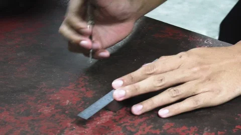 A thai engineering student measuring metal's dimension. Stock Footage 98201469