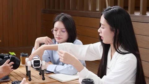 Thai Engineers Testing Robotic Dog Prototype in Bangkok Startup Office Stock Footage 345318642