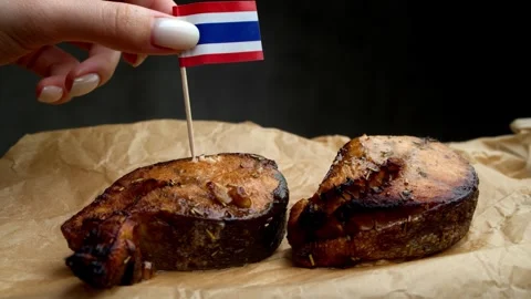 Thai flag in crispy fish steak, symbol of local Thai coastal seafood. Stock Footage 323010151