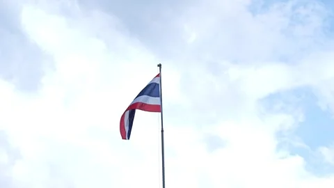 Thai flag waving against a cloudy blue sky. Stock Footage 348156701
