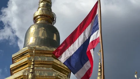 Thai Flag Waving Next To Golden Temple in Chiang Mai Stock Footage 259838480