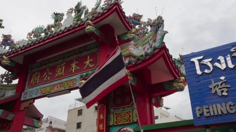 Thai flag waving at a temple gate entrance Stock Footage 345859769