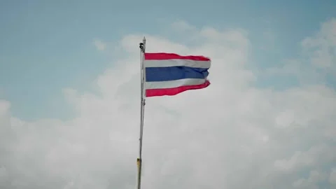 Thai flag waving in the wind blue sky and white clouds in the background Stock Footage 300757164