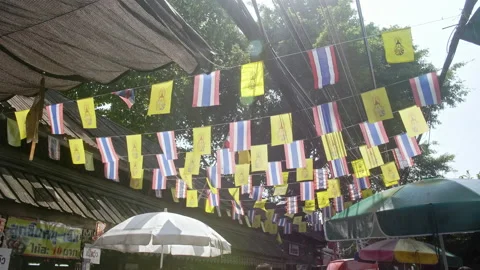 Thai flags decoration at Wang Lang Market Stock Footage 229767945
