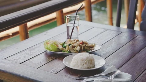 Thai food in an authentic rustic restaurant near the sea Stock Footage 327962661