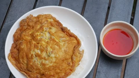 Thai Fried Egg with Minced Pork Over Rice Stock Footage 327949479