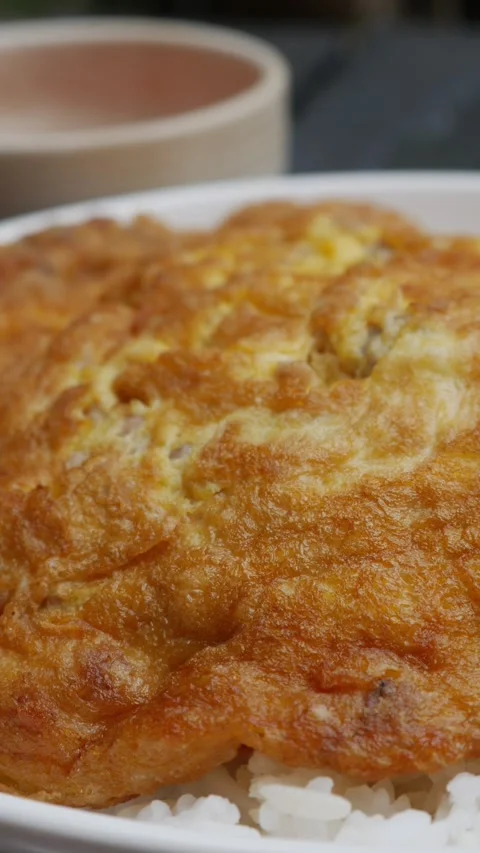 Thai Fried Egg with Minced Pork Over Rice Video stock 327949486