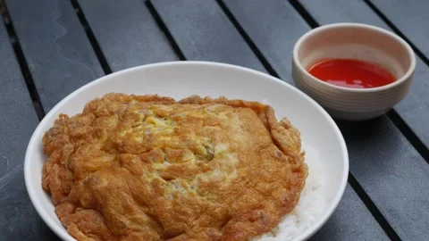 Thai Fried Egg with Minced Pork Over Rice Stock Footage 328274640
