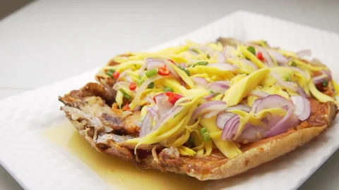 Thai Fried Fish with Mango Salad Stock Footage 146292411