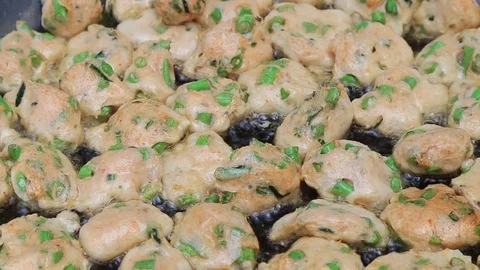 Thai fried fish-paste balls with hot oil in big pan, Thai street food. Stock Footage 82290364