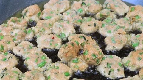 Thai fried fish-paste balls with hot oil in big pan, Thai street food. Stock Footage 82290382