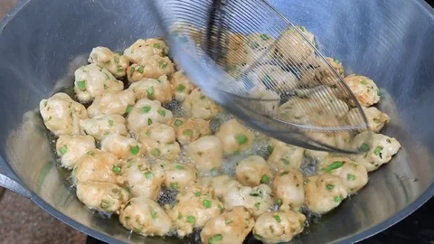 Thai fried fish-paste balls with hot oil in big pan, Thai street food. Stock Footage 82290479