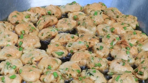 Thai fried fish-paste balls with hot oil in big pan, Thai street food. Stock Footage 82291234