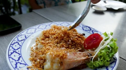 Thai Fried Shrimp with Crispy Garlic Served on a Patterned Plate Stock Footage 333289073