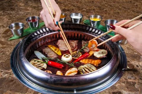 Thai grill on the table with various snacks. Stock Photos