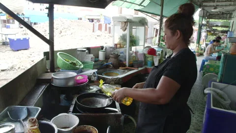 Thai heating wok and adding oil. Stock Footage 146235211