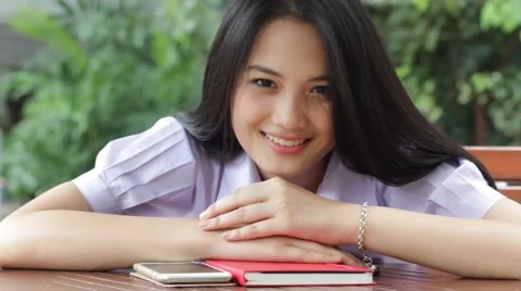 Thai high school student uniform teen beautiful girl happy and relax Stock Footage 68337524