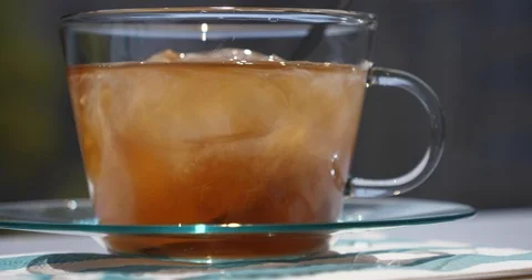 Thai Iced Tea - Coconut Tea. Milky coconut is poured and floats freely Stock Footage 100005965