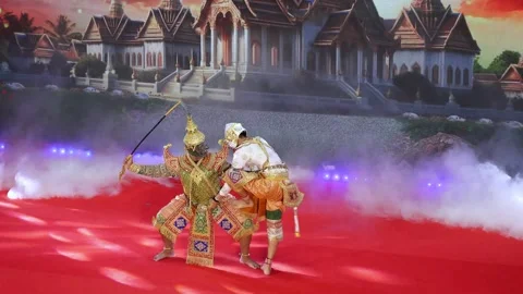 Thai Khon performance of Hanuman fighting Indrajit and standing on his thigh Stock Footage 337421552