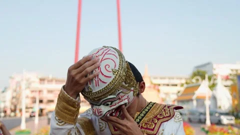 Thai Khon Performer Putting On Traditional Hanuman Mask Outdoors Stock Footage 340118136
