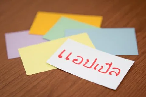 Thai; Learning New Language with the Flaish Card (Translation; Apple) Stock Photos