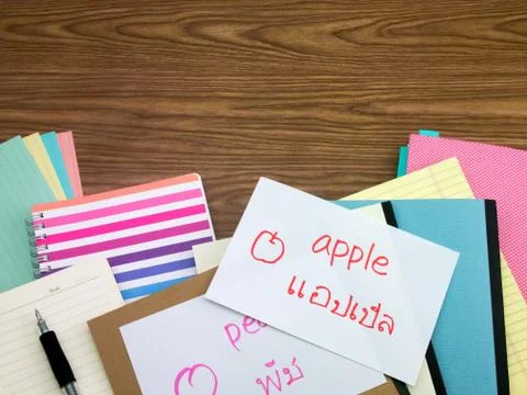Thai; Learning New Language Writing Words on the Notebook Stock Photos