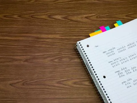 Thai; Learning New Language Writing Words on the Notebook Stock Photos