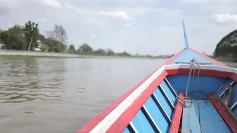 Thai long tail boat or ferry sailing in the canal or river. Video stock 238882356