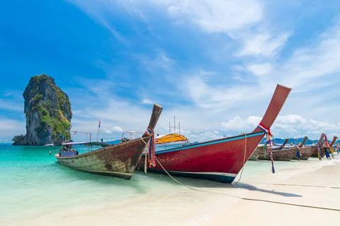 Thai long tail boats on the beach with beautiful island, Krabi Phuket Thailan Stock Photos