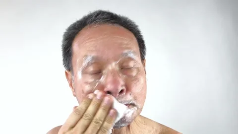 Thai man is cleaning his face by facial cleanser, in door  Chiangmai  Thailand. Stock Footage 307303535