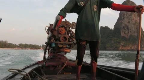 Thai man drives a long-tail boat in Ao Nang, Thailand Stock Footage 51016413