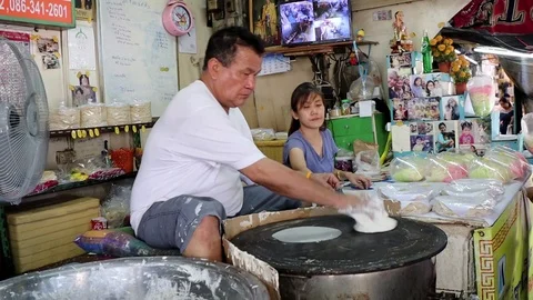 Thai man making pancakes, Pak Khlong Talad market, Bangkok Stock Footage 97201281