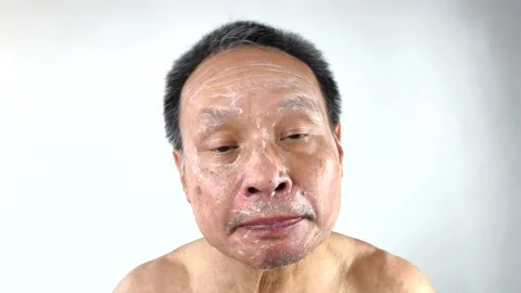 Thai man is massaging his face , in door  Chiangmai  Thailand. Stock Footage 307303572
