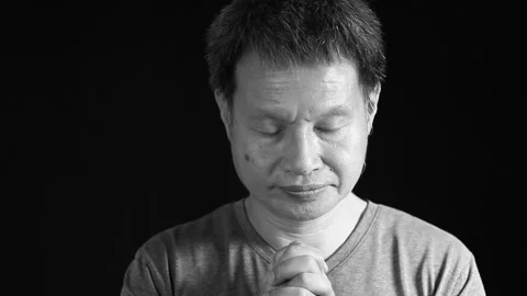 Thai man is praying  in monochrome, in studio   Chiangmai Thailand Stock Footage 165310070
