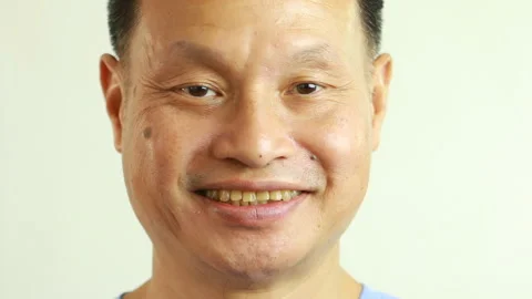 Thai man is smiling  with white  background, in studio   Chiangmai Thailand Stock Footage 162618617