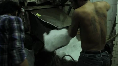 Thai Men Crushing and Bagging Ice Stock Footage 8665994