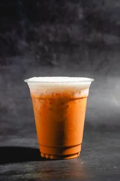 Thai Milk Tea Refreshing Iced Tea Beverage Served in Glass with Ice Stock Photos